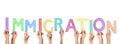 People holding word IMMIGRATION made of cardboard letters on background. Banner design Royalty Free Stock Photo