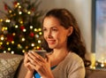 happy woman drinking tea or coffee on christmas Royalty Free Stock Photo
