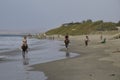 People on horseback are walking along the beach. Mancora, Peru Royalty Free Stock Photo