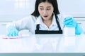 People, housework and housekeeping concept. smile young woman in protective gloves blue wiping dust using spray and Royalty Free Stock Photo