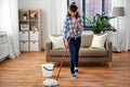 Happy asian woman with mop cleaning floor at home Royalty Free Stock Photo