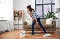 Happy asian woman with mop cleaning floor at home Royalty Free Stock Photo