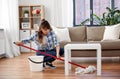 Happy asian woman with mop cleaning floor at home Royalty Free Stock Photo