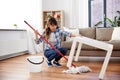 Happy asian woman with mop cleaning floor at home Royalty Free Stock Photo