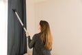 People, housework and housekeeping concept - woman with vacuum c