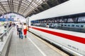 People hurry to the intercity train