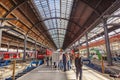 People hurry to the train at historic classicistic train station in Wiesbaden, Germany