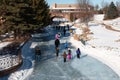 People ice skating on a frozen lake Royalty Free Stock Photo