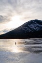 People ice skating on the frozen Vermilion lakes Royalty Free Stock Photo