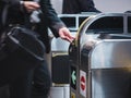 People insert ticket to Ticket Entrance Train station