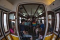 People inside a famous yellow tram in Lisbon