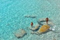 02.09.2018. People inside paradise clear torquoise blue water in Favignana island, Cala Azzura Beach, Sicily South Italy.