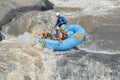 People inside a rafting boat going down Fish river in Socorro city, Brazil.