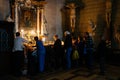 People inside the Zagreb Cathedral lighting candles. Croatia, European capital travel destination