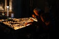 People inside the Zagreb Cathedral lighting candles