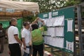 People inspect candidate lists before Pre-election at Khonkaen, Thailand