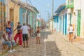 People interacting in typical village street in Cuba