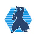 Silhouette of a sword warrior in action pose. Silhouette of kendo martial art pose. Royalty Free Stock Photo