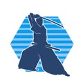 Silhouette of a sword warrior in action pose. Silhouette of kendo martial art pose. Royalty Free Stock Photo