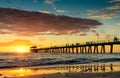 People on the jetty at sunset Royalty Free Stock Photo