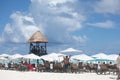 People joying sunlight at Cancun beach in Caribbean Sea. Exotic Paradise. Travel, Tourism and Vacations Concept