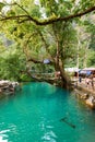 Blue lagoon in Vang Vieng, Laos, famous travel destination with clear water and tropical landscape Royalty Free Stock Photo