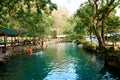 Blue lagoon in Vang Vieng, Laos, famous travel destination with clear water and tropical landscape Royalty Free Stock Photo