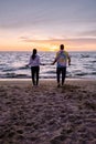 People with jumprope exersise on the beach, couple men and woman exersise together outsied on the beach in the Royalty Free Stock Photo