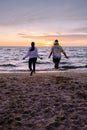 People with jumprope exersise on the beach, couple men and woman exersise together outsied on the beach in the Royalty Free Stock Photo