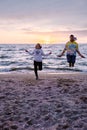 People with jumprope exersise on the beach, couple men and woman exersise together outsied on the beach in the Royalty Free Stock Photo