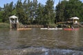 People kayaking along a navigable waterway in the Tigre delta, Argentina