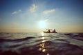 People kayaking at sunset Royalty Free Stock Photo
