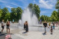 People keeping cool in the fountains at The parc de la PÃÂ©piniÃÂ¨re in Nancy