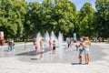 People keeping cool in the fountains at The parc de la PÃÂ©piniÃÂ¨re in Nancy