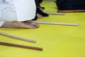 People in kimono on martial arts weapon training seminar