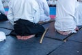 People in kimono on martial arts weapon training seminar