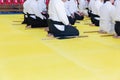 People in kimono on martial arts weapon training seminar