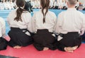 People in kimono on martial arts weapon training seminar