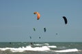 People kite surfing at beach