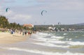 People and kites of wind surfers in a beach in Nam Tien, Vietnam Royalty Free Stock Photo