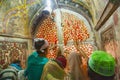 people knot wishing and good luck threads at the window of the sacred grave at Jama Masjid in Fatehpur Sikri mosque in Agra