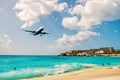 People and landing plane at st.Maarten. Maho beach Royalty Free Stock Photo