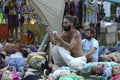 People laying on ground and meditating, yoga instructors playing instrument