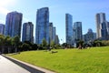 People laying and relaxing on the green lawn in Yaletown park