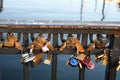 People leae love lock at Nyhcan canal bridge in Copenhagen