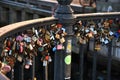 People leae love lock at Nyhcan canal bridge in Copenhagen