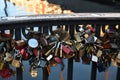 People leae love lock at Nyhcan canal bridge in Copenhagen