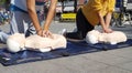 People learning how make first aid heart compressions Royalty Free Stock Photo