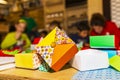 People learning to make origami paper boxes