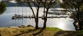 People learning to sail on a sailing boat with a teacher teaching the lesson in the San Juan reservoir in Madrid